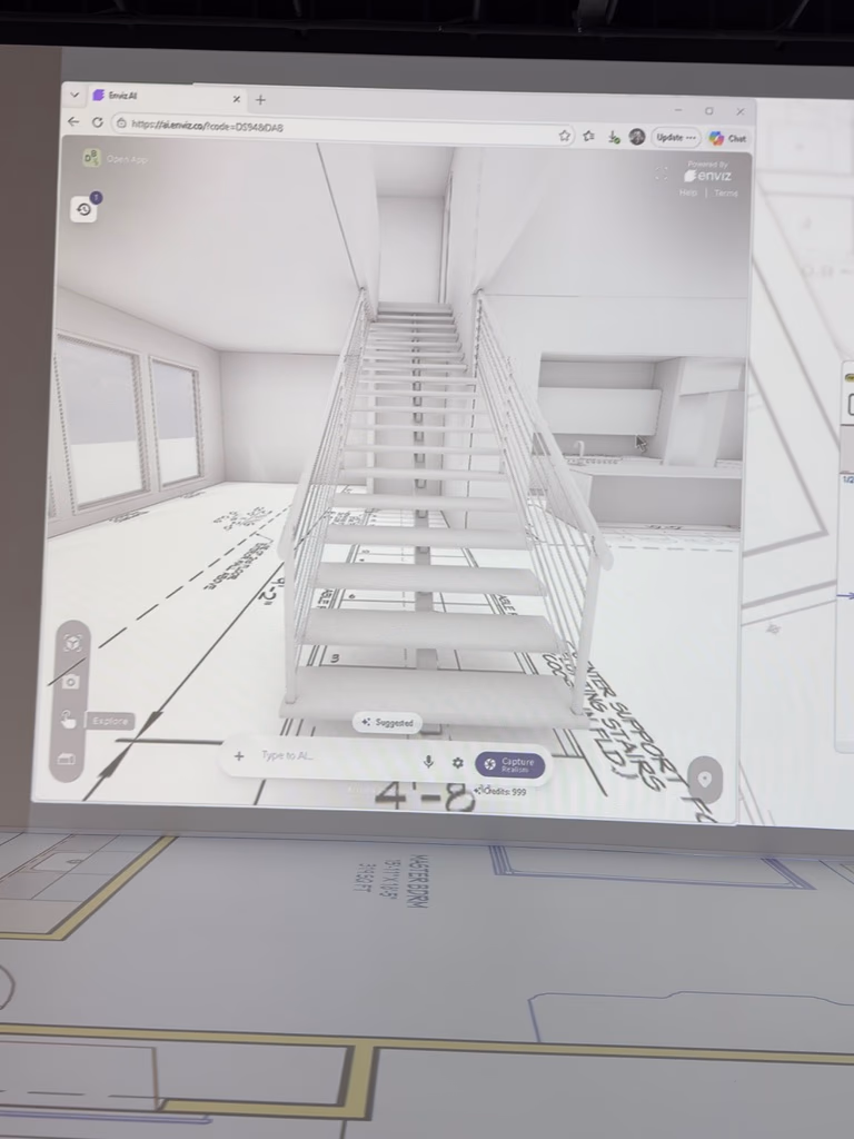 A 3D interior rendering with a modern staircase visualized in mixed reality at the Walk Your Plans NWA studio