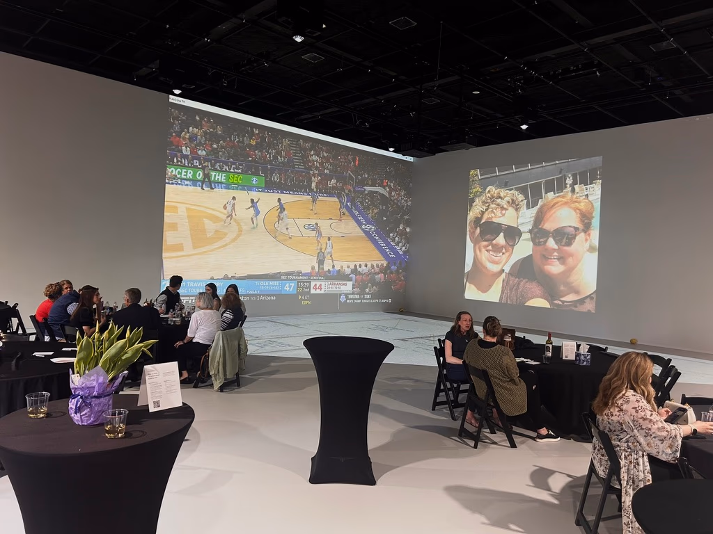 A basketball watch party using the Walk Your Plans NWA studio canvas as a large projection surface